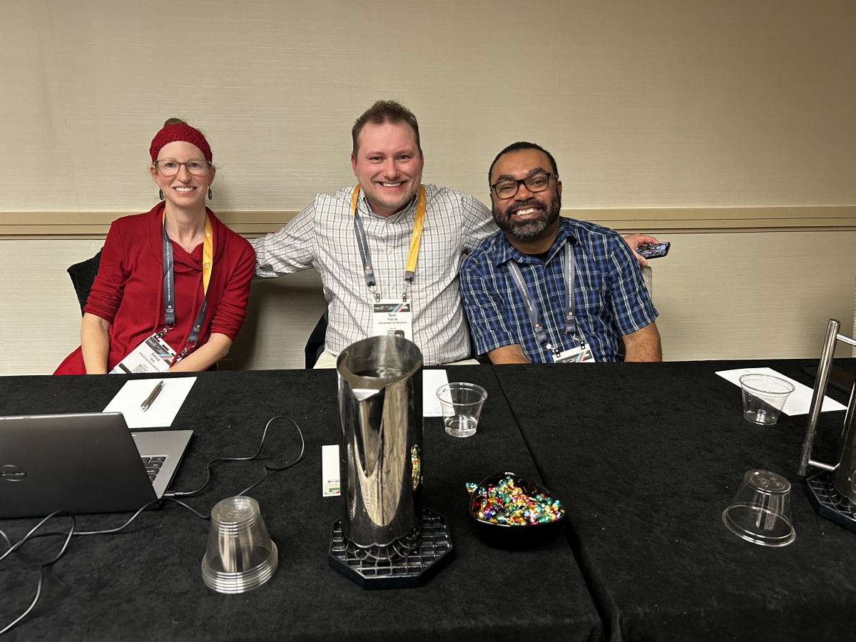 Denise Levy and Ryan Papciak sitting at table