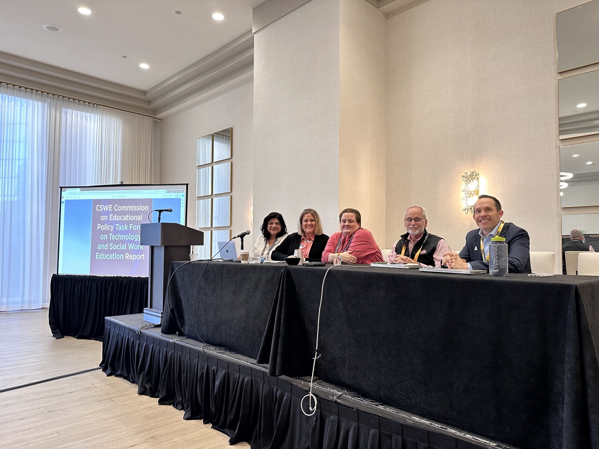 Mark Trahan sitting at panelist table 1